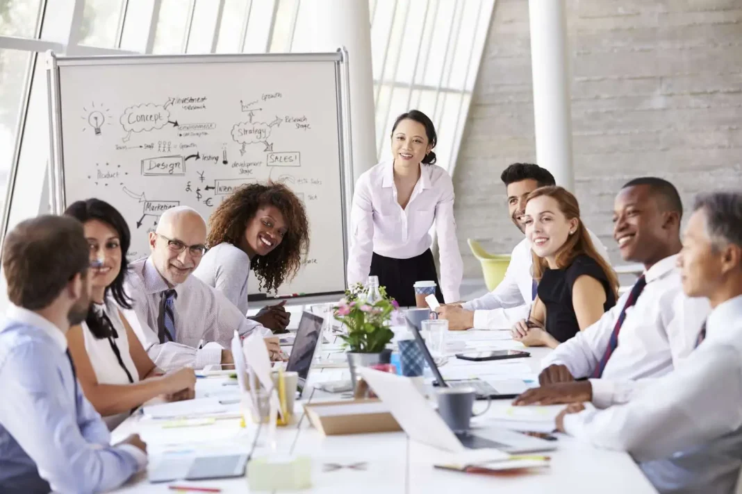 asian-businesswoman-leading-meeting-at-boardroom-table-504987926-5ad21419c5542e0036d7003e